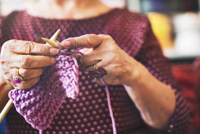 Image of a person knitting