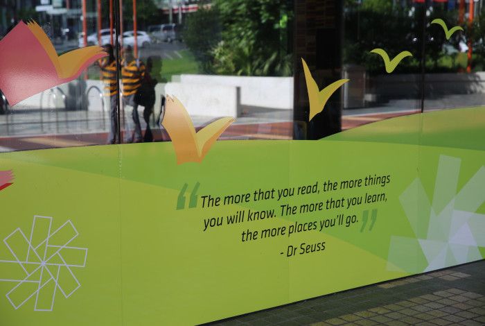 Image: Front window of Dandenong Library with a mural displaying a quote by Dr. Suess