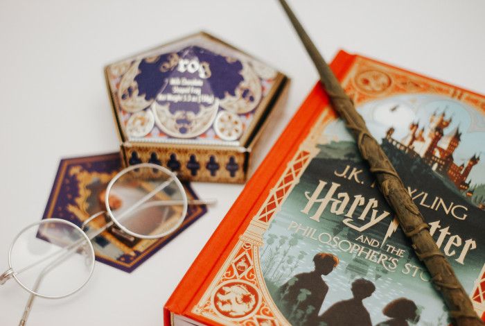 A wand sitting on a Harry Potter book