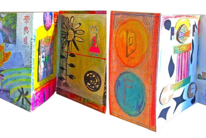 Series of open art journals displaying bright content