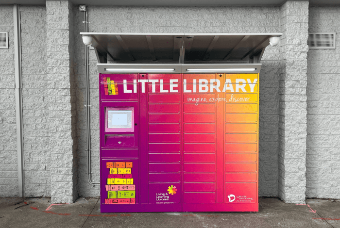 A set of brightly coloured lockers with the words Little Library across the top.