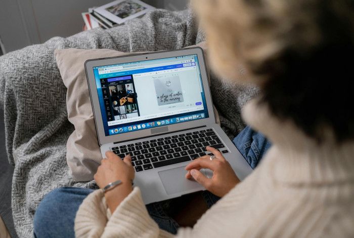 A woman working on her laptop.