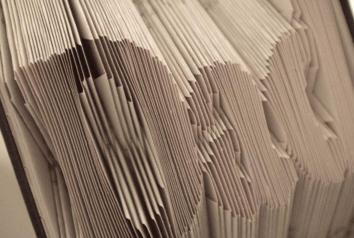 Book pages folded into art.