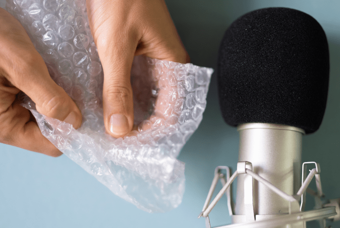 Microphone recording the sound of a bubble wrap being pressed.