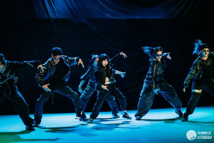 K-Pop dancers on stage.
