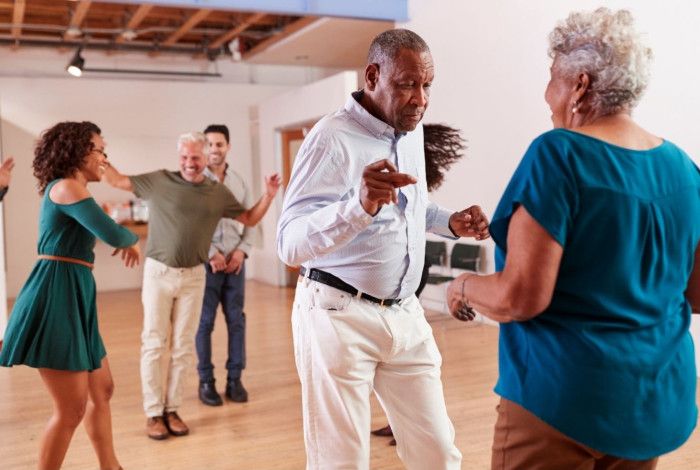 Group of older people dancing.