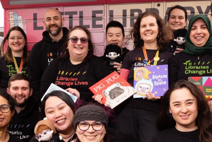 Library staff at the front of the set of lockers known as Little Library: Douglas Street