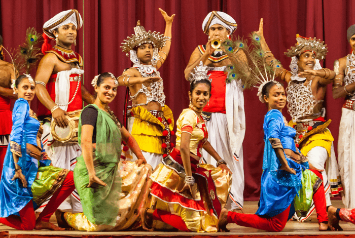 A large group of people participating in kendyan dance.