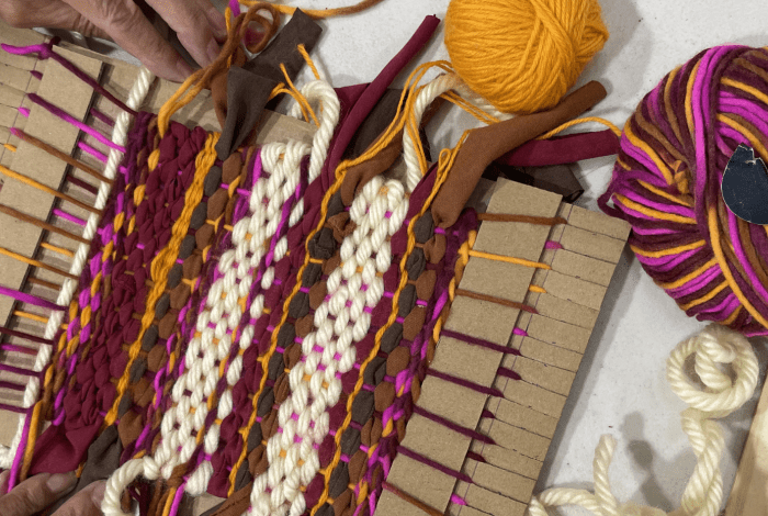 Textile weaving with various yarns on a formboard.