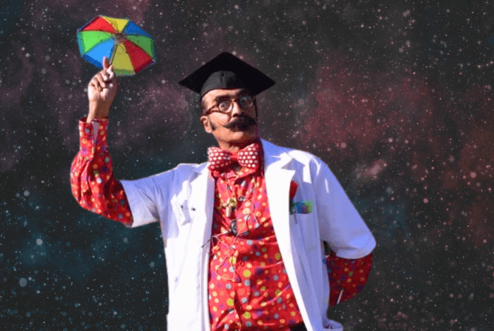 Professor Q on a starry background holding an umbrella. 