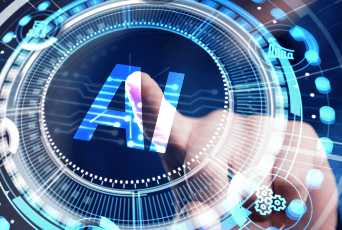 A person touching a transparent screen displaying an image of a circle with letters AI displayed in the middle of it. 