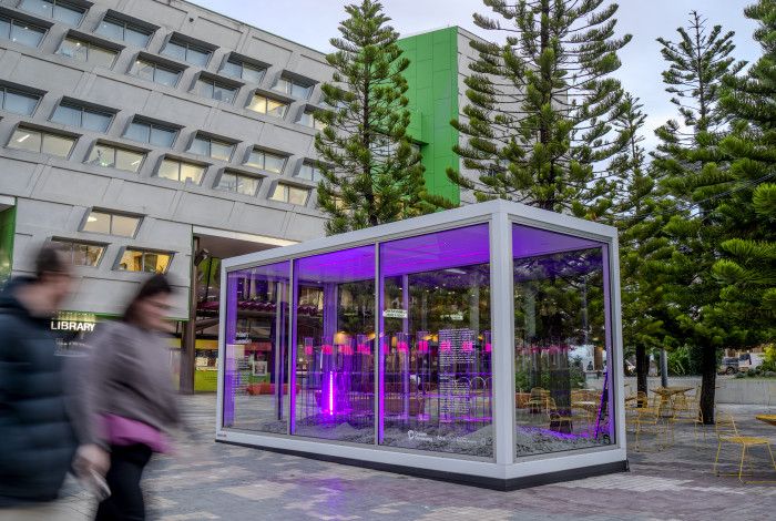 Glass display box with the Dandenong Library andCivic Centre in the background.