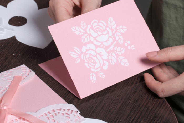 Closeup of a person doing card making.