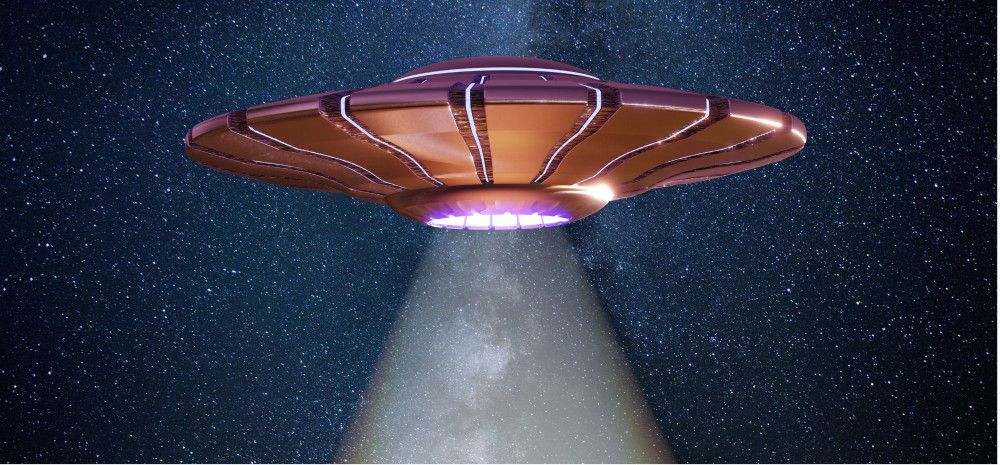 A flying saucer with a beam of light coming out of it.