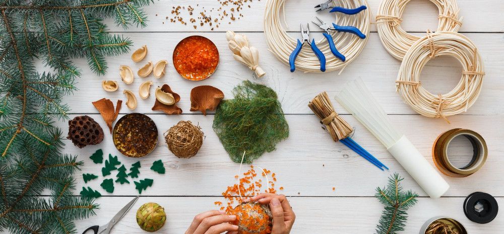 A table with Christmas craft materials. 