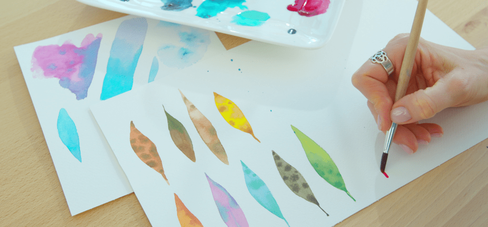 Assortment of painted gum leaves.