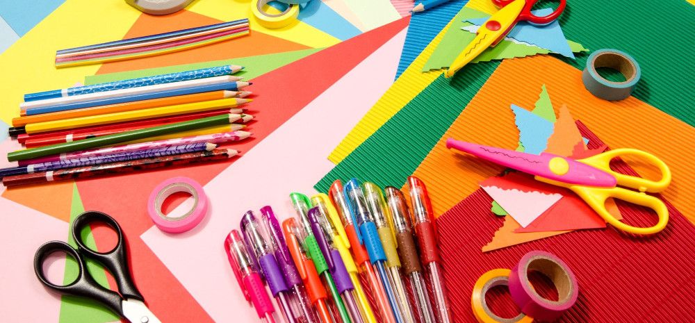 Colourful stationery including pens, pencils, scissors and tape.