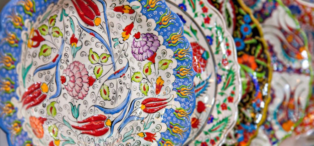 Porcelain plates with colourful arabesque embroidery. 