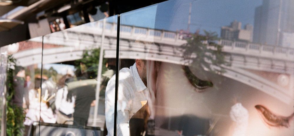 Womans face reflected in restaurant window