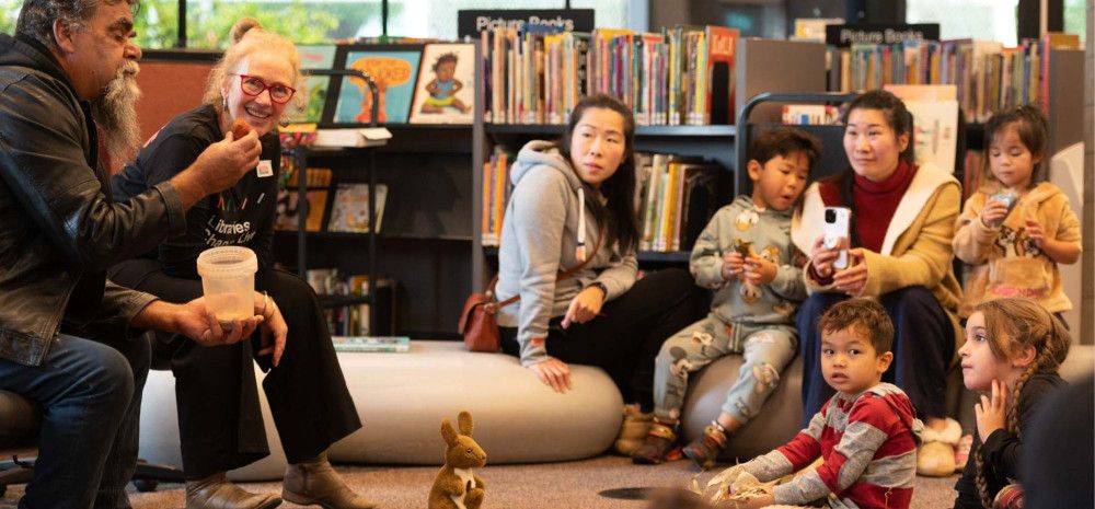 A family enjoying an indigenous themed storytime at the library.