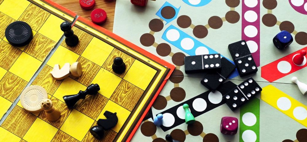 Board games spread out on table.