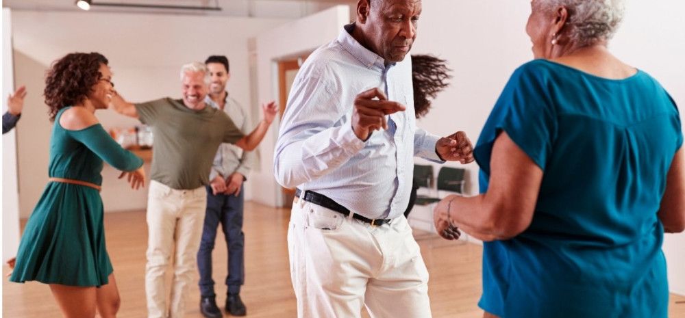 Group of older people dancing.