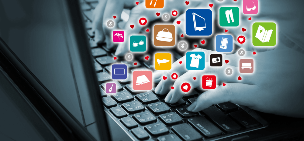 Hands typing on keyboard with many app-like icons and love hearts hovering above them.