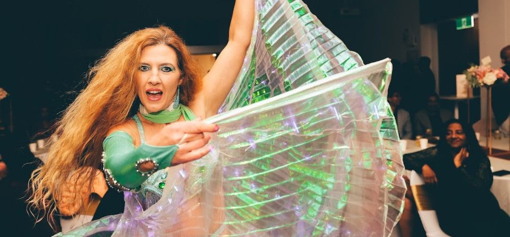 A woman belly dancing. 