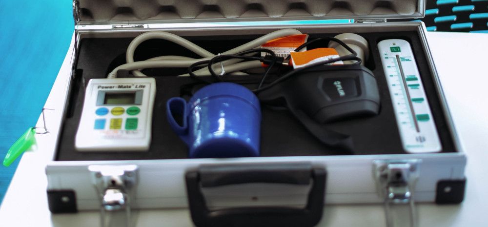 Equipment for improving household energy efficiency inside a padded metal case.