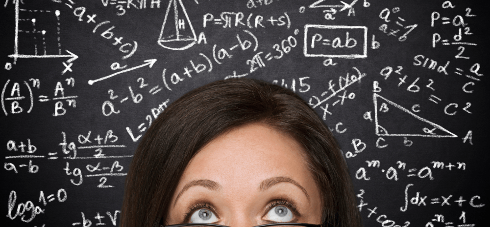  A woman's face  with puzzled expression placed in front of a blackboard covered with mathematical equations.