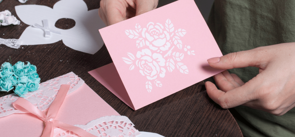Closeup of a person doing card making.