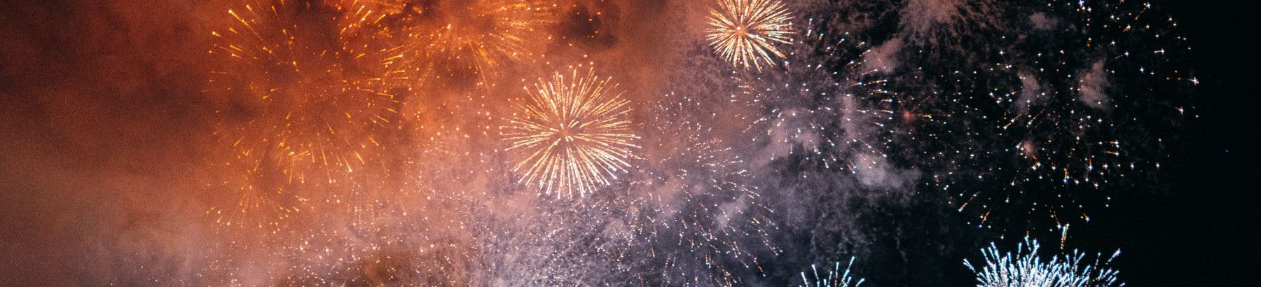 Fireworks lighting up a night sky.