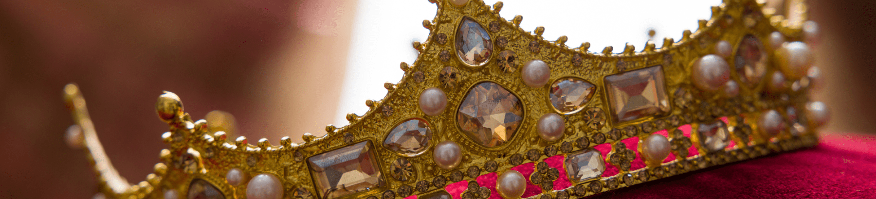 A Kings's crown featuring jewels.