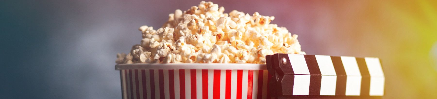 Bucket of popcorn and clapperboard.