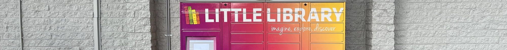 A set of brightly coloured lockers with the words Little Library across the top
