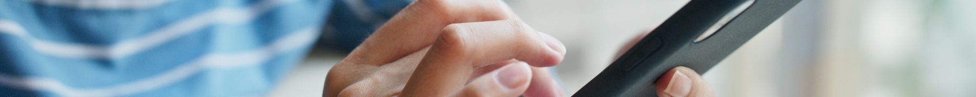 Closeup of person using a mobile phone.