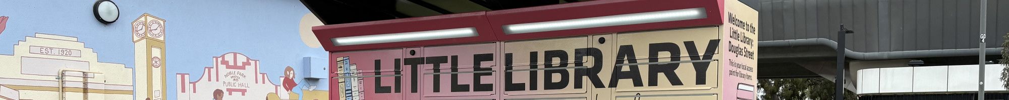 A set of brightly coloured lockers in Noble Park known a Little Library: Douglas Street.