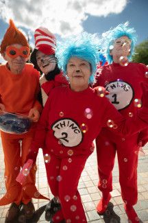 Four people dressed as Dr Seuss characters.