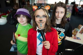 Three people, two are in cosplays from Undertale and Five Nights at Freddy's.