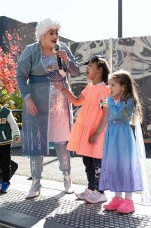 Elsa and two children on the stage.