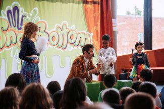 Comedian Mr Snotbottom performs in front of children at the library during the BIG Summer Read Finale.