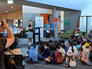 Library Services Senior Co-ordinator Monique Godbehere and Mayor Sophie Tan with library staff and attendees at the BIG Summer Read finale event.