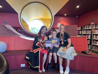 BIG Summer Read grand prize winner with Mayor Sophie Tan and Library Services Senior Co-ordinator Monique Godbehere