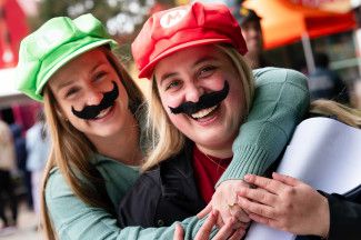 Two people in matching cosplay costumes at Dandy-Con.