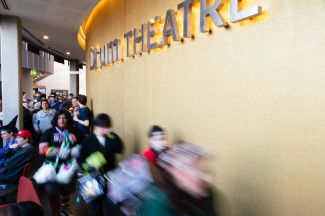 People entering the Drum Theatre during Dandy-Con.