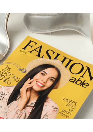A yellow Fashion magazine with some high heel shoes.