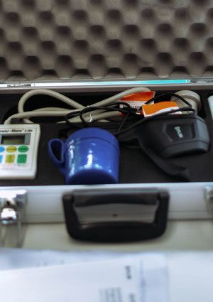 Equipment for improving household energy efficiency inside a padded metal case.